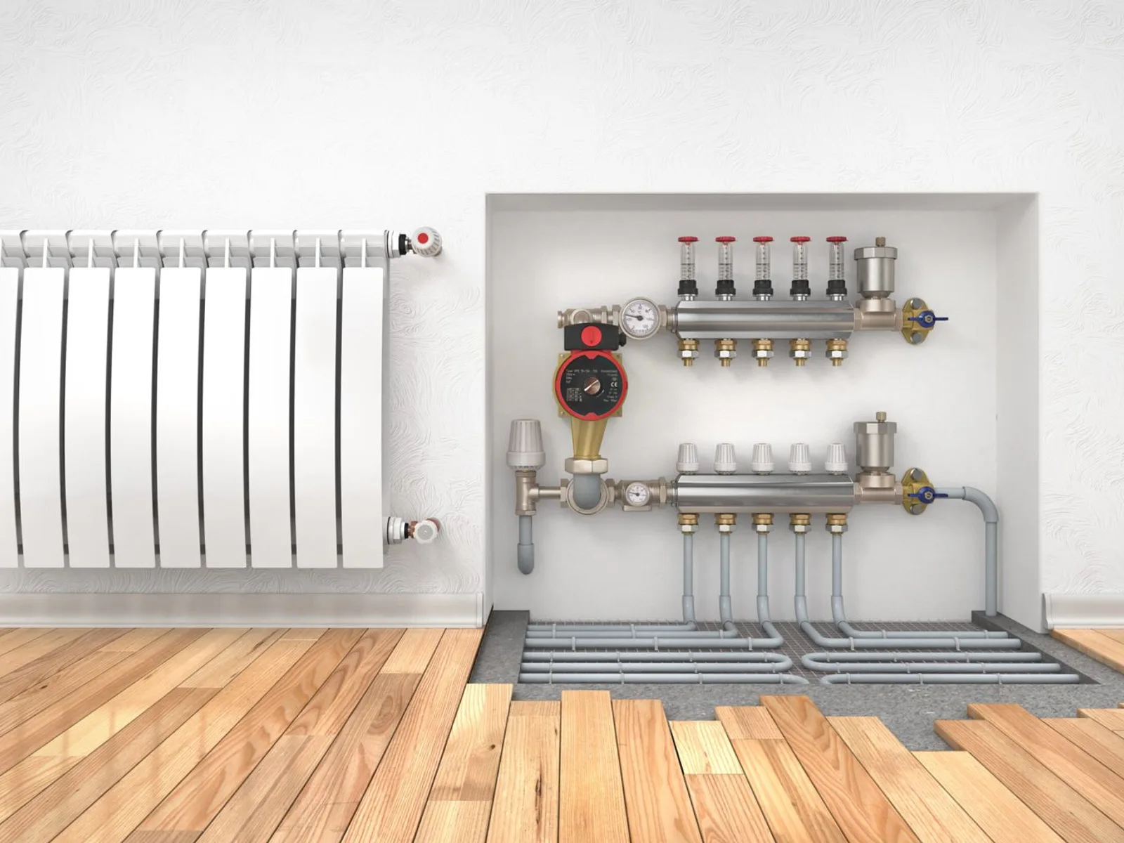 Plancher chauffant hydraulique : collecteur et boucles de tubes, en complément d'un radiateur, alimentés par la pompe à chaleur.